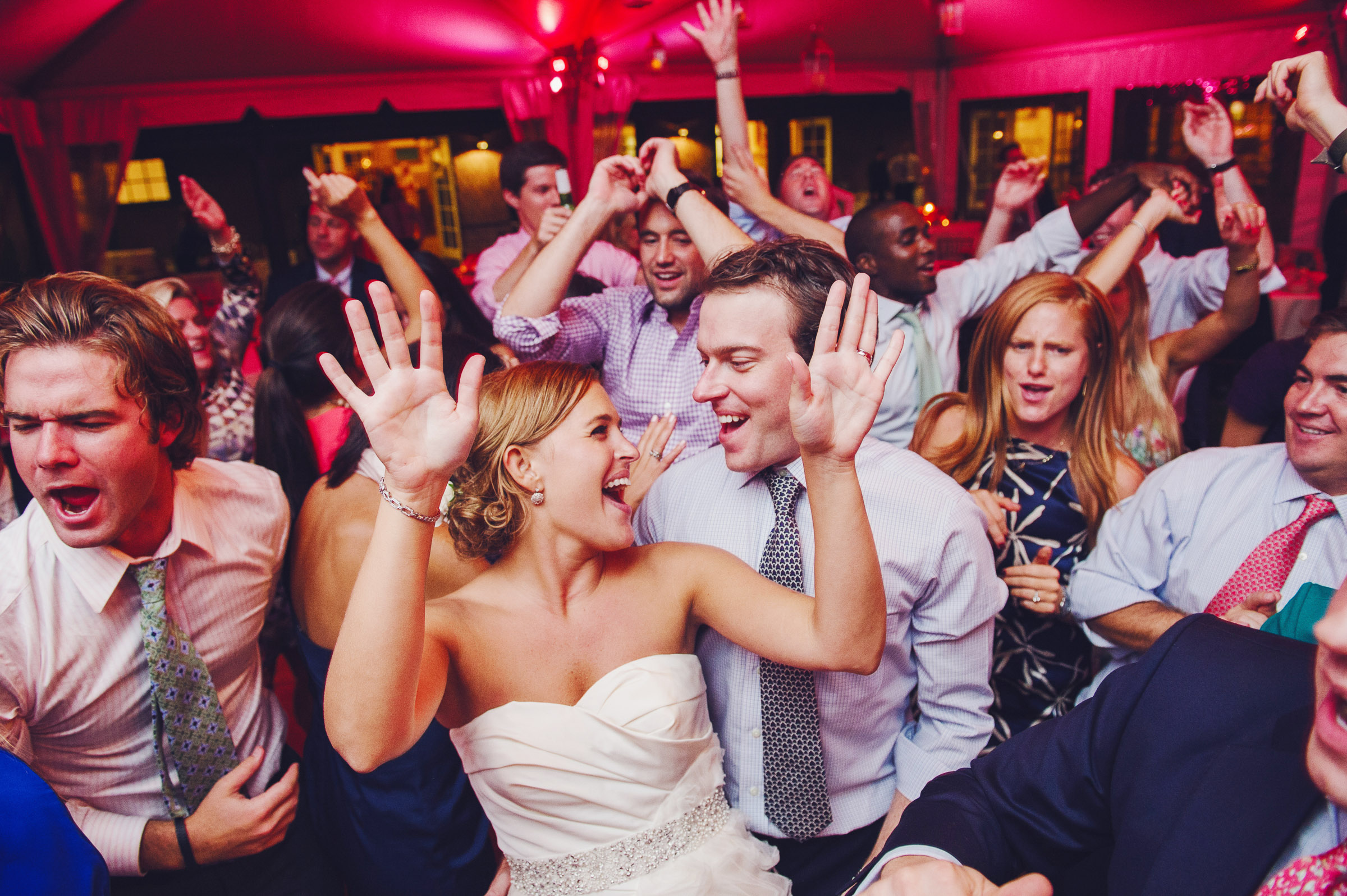 people dancing with bride at wedding